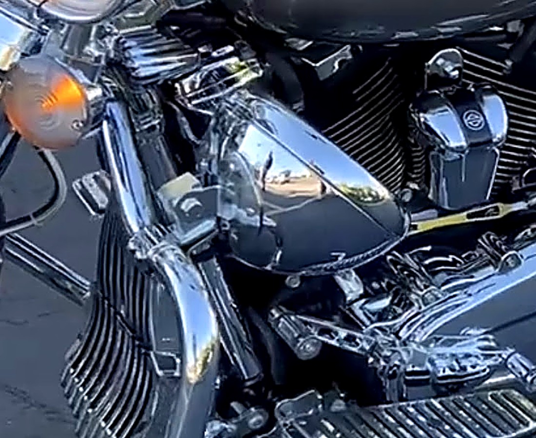 Chrome AMS Pod detail on a Harley bagger
